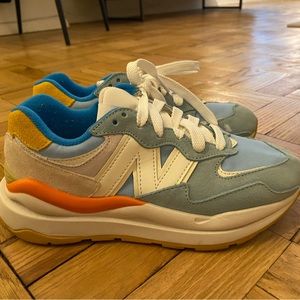 New Balance Women’s 57/40 Sneaker. Size 7.5. Tan, light blue with orange accent.